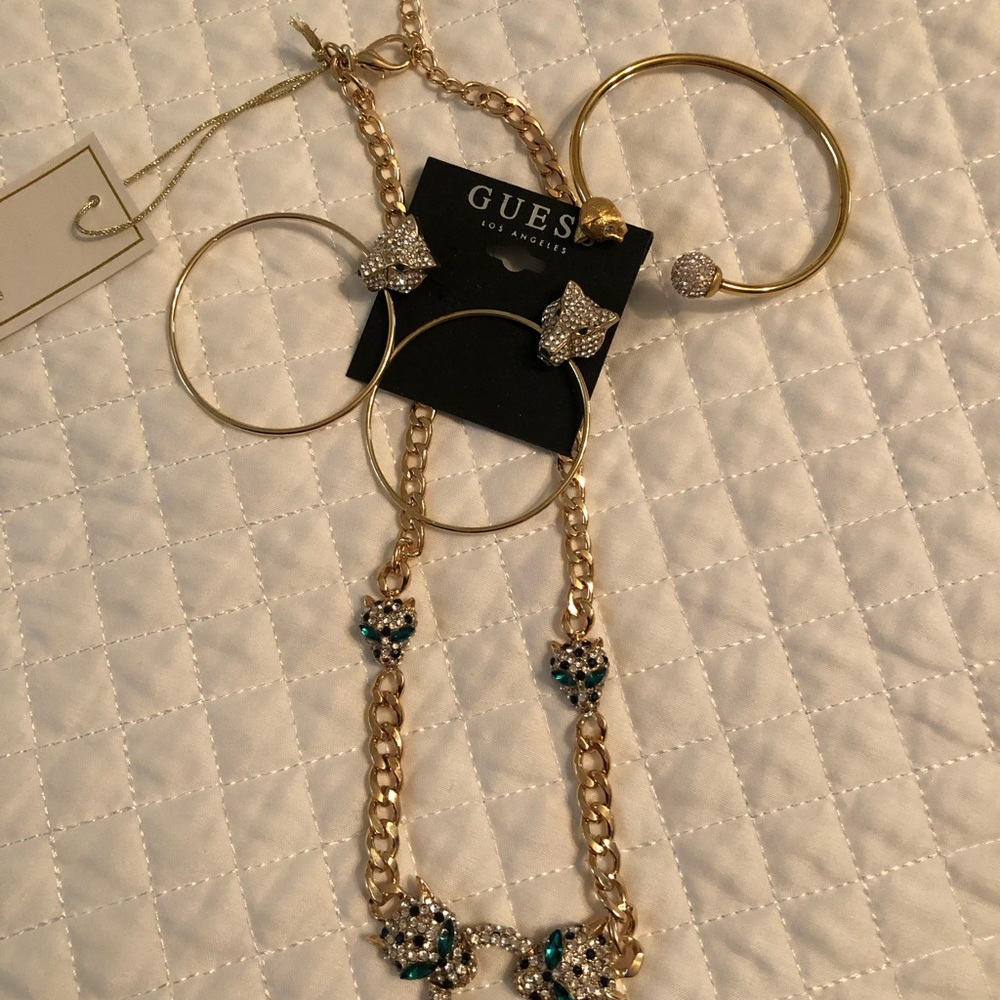 Necklace, earrings, and bracelet set.